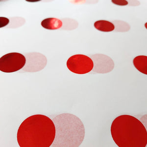 White tissue paper with red shiny spots