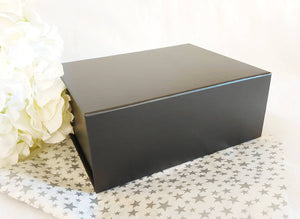 Black Magnetic Gift Box zoom with silver star tissue paper