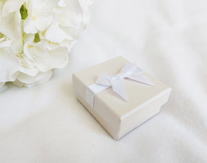 Ivory Card Ring Box with attached Satin Ribbon Bow and Foam Insert oblique