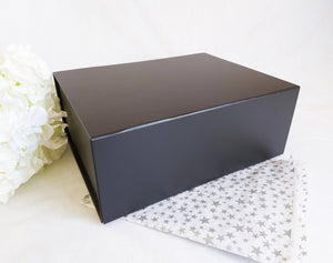 Black Magnetic Gift Box front with silver start tissue paper