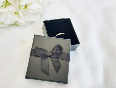 Black Card Ring Box with attached Satin Ribbon Bow and Foam Insert title