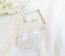 Load image into Gallery viewer, Ivory Card Ring Box with attached Satin Ribbon Bow and Foam Insert title
