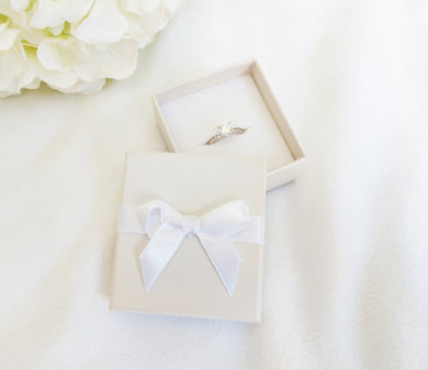 Ivory Card Ring Box with attached Satin Ribbon Bow and Foam Insert title